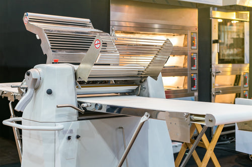 A floor-standing dough sheeter machine